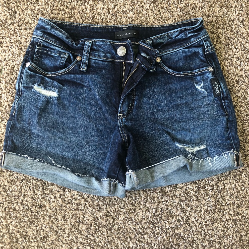 Mid rise stretch denim shorts with distressing